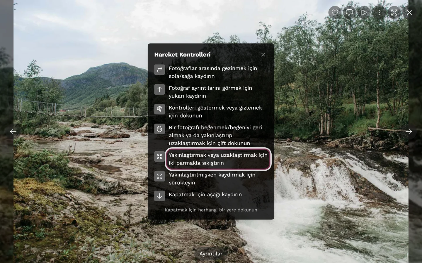 Tam ekranda gösterilen hareket kontrolleri, iki parmakla sıkıştırma satırı işaretli